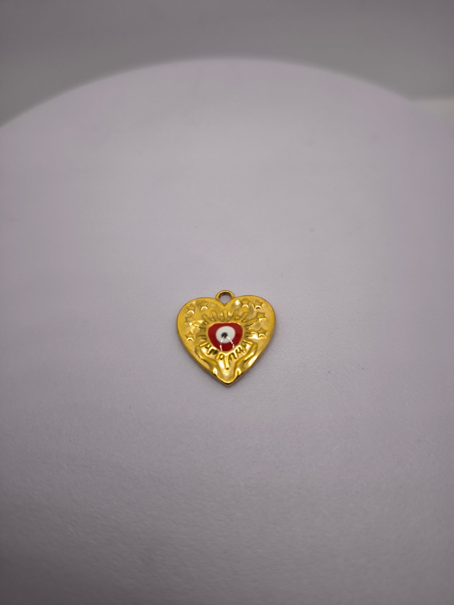 Coeur doré et oeil rouge